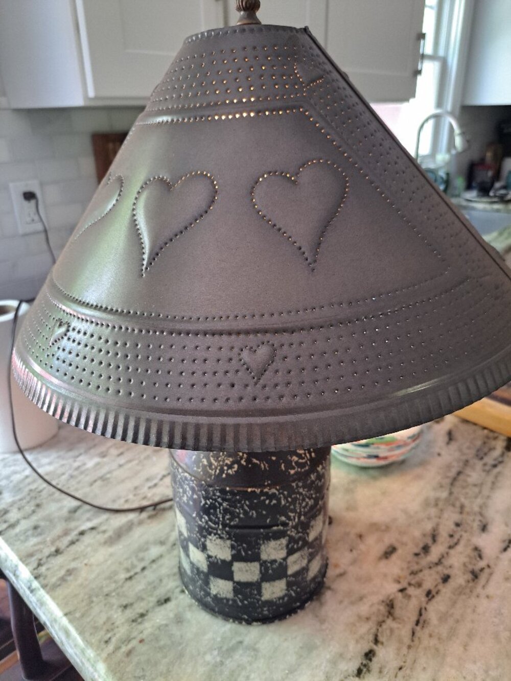 vintage punched tin table lamp, a hallmark of primitive or farmhouse-style decor